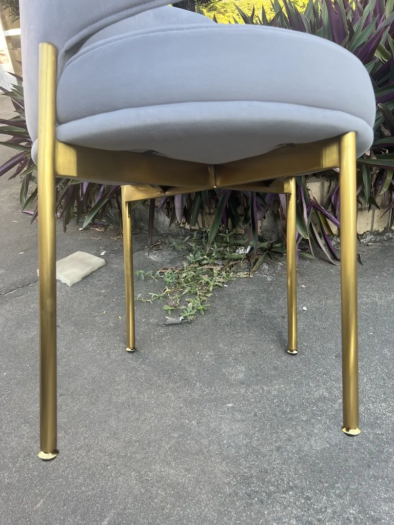 Titanium-gold stainless steel frame seen from below the seat