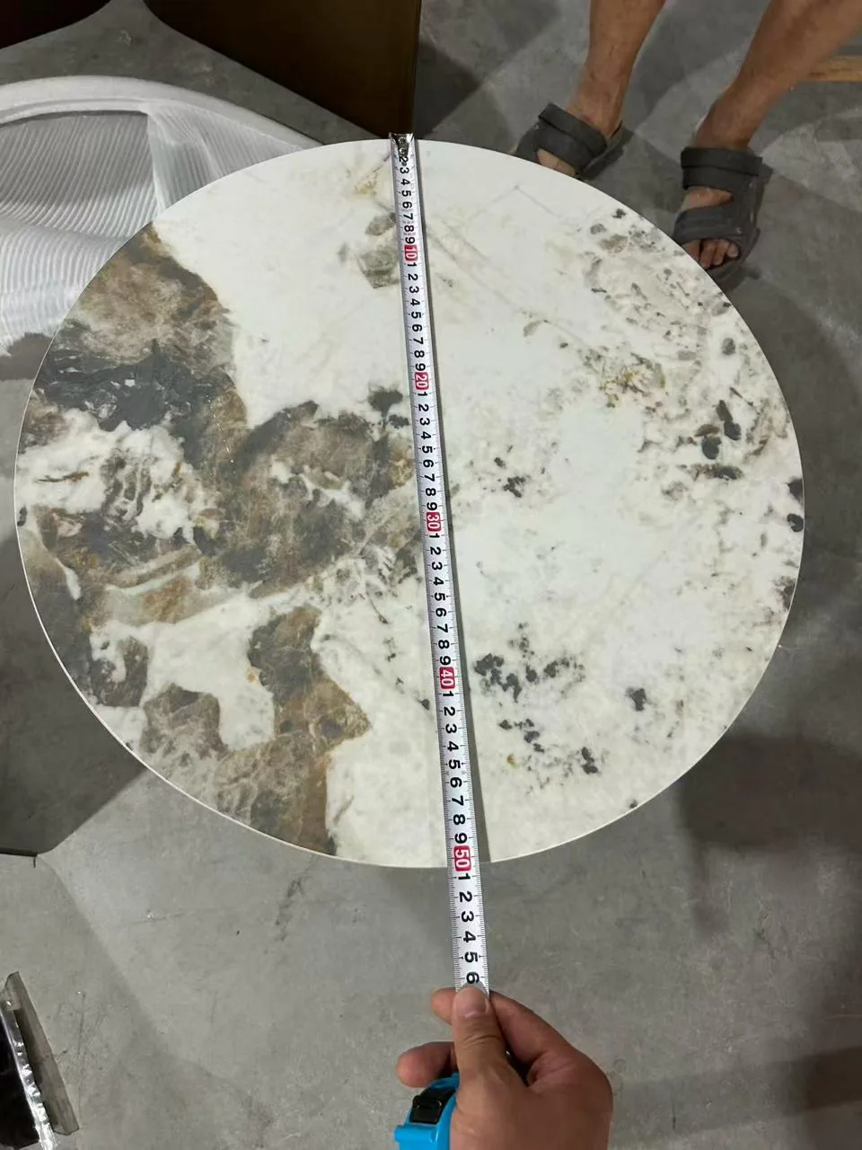 Tape measure across a Pandora-pattern tabletop