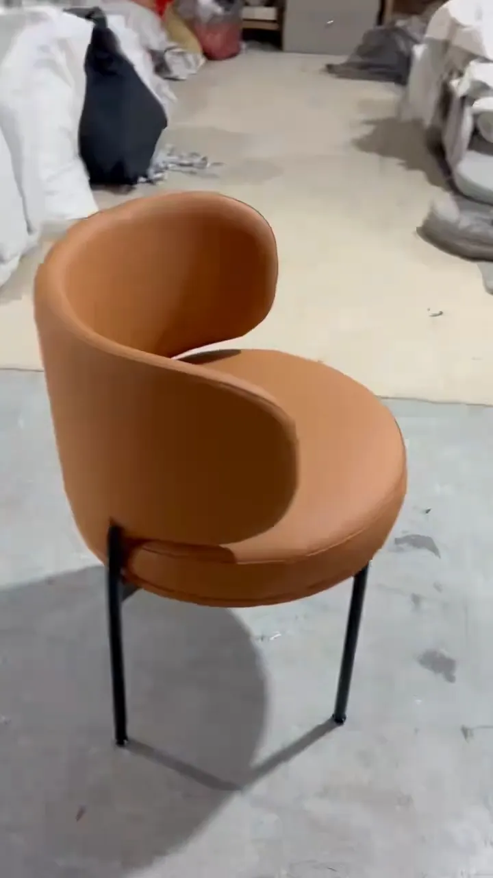 Finished chair in the client’s microfiber leather, side view showing the curved back
